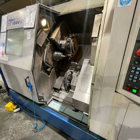 DAEWOO/DOOSAN Puma TT 1800 SY 18 i Fanuc Metal Processing Lathes CNC Lathe Has two 12 position turret heads with live tooling (C- axe), one with Y axe,
sub spindle, power chuck, cooling arrangement and chip conveyor.
Control: Fanuc 18 i. With many accessories. Korea