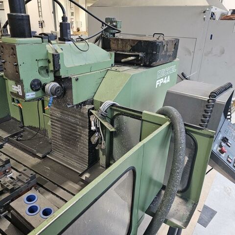 DECKEL FP4A  Metal Processing Milling machines Universal Milling Machine CNC milling machine with Heidenhain TNC 355 control and housing arround working
table. Germany